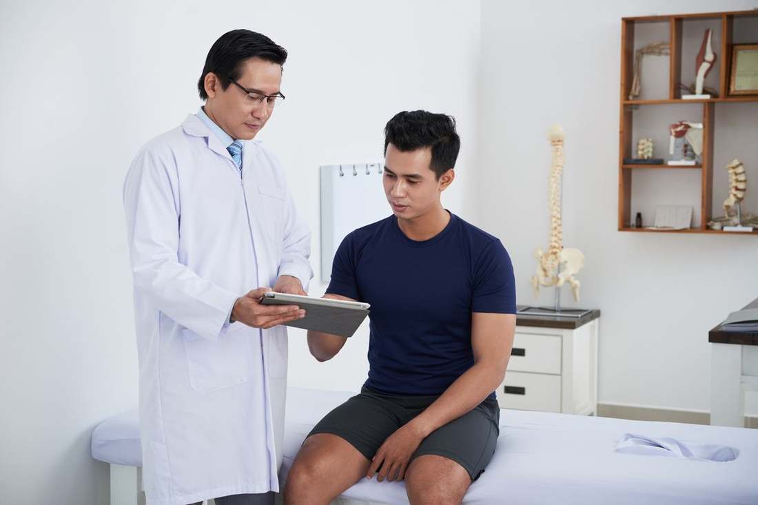 Provider reviewing labs with a male patient
